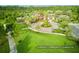 The Serenoa Community Clubhouse features lush landscaping, a playground, and a grand entrance at 17426 Saw Palmetto Ave, Clermont, FL 34714