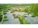 The Serenoa Community Clubhouse shows modern architecture, parking, and lush landscaping at 17426 Saw Palmetto Ave, Clermont, FL 34714