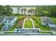 Community gathering area with a dock, picnic tables, and grassy field and parking at 17426 Saw Palmetto Ave, Clermont, FL 34714