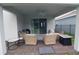 Relaxing covered patio with comfortable seating and a ceiling fan for warm days at 17426 Saw Palmetto Ave, Clermont, FL 34714