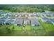 Aerial view of the home's rear exterior, showcasing a fenced yard and well-maintained lawn at 17426 Saw Palmetto Ave, Clermont, FL 34714