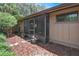 Exterior view of screened in patio with view of mulch garden at 199 Heron Bay Cir, Lake Mary, FL 32746