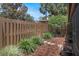 Backyard featuring a garden, fence, and mulch garden bed at 199 Heron Bay Cir, Lake Mary, FL 32746