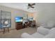 Bright room features a ceiling fan, two windows, and comfortable seating at 199 Heron Bay Cir, Lake Mary, FL 32746