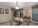 Cozy dining room with a glass table, seating for four, and large windows for natural light at 199 Heron Bay Cir, Lake Mary, FL 32746