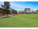 Exterior shot featuring well-maintained lawn and mature trees at 199 Heron Bay Cir, Lake Mary, FL 32746