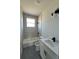 Well-lit bathroom featuring a tub-shower combo, vanity with black accents, and modern fixtures at 230 Lucile Way, Orlando, FL 32835