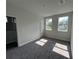 Sun-filled bedroom with neutral walls, carpet, and plenty of natural light from two windows at 230 Lucile Way, Orlando, FL 32835