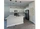 Modern kitchen with white cabinets, a center island, pendant lighting, and stainless steel appliances at 230 Lucile Way, Orlando, FL 32835