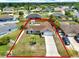 Neighborhood street view showing the attractive landscaping and long driveway at 2375 Belen Dr, Deltona, FL 32738