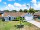 Inviting single-story home with manicured lawn and updated architectural details at 2375 Belen Dr, Deltona, FL 32738