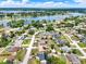 An aerial view of a neighborhood with homes near a large lake at 2375 Belen Dr, Deltona, FL 32738