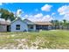 Spacious backyard with a partially covered patio, perfect for outdoor entertaining at 2375 Belen Dr, Deltona, FL 32738