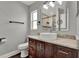 Elegant bathroom with a vessel sink, granite countertop, and dark wood vanity at 2375 Belen Dr, Deltona, FL 32738