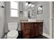 Modern bathroom with a vessel sink, dark wood vanity, and a large illuminated mirror at 2375 Belen Dr, Deltona, FL 32738