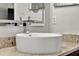 Modern bathroom featuring a sleek vessel sink, stylish faucet, and a granite countertop at 2375 Belen Dr, Deltona, FL 32738