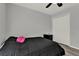 Bedroom featuring hardwood floors, large closet, and modern ceiling fan with overhead light at 2375 Belen Dr, Deltona, FL 32738