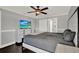 Comfortable bedroom features a ceiling fan and ample natural light from the window at 2375 Belen Dr, Deltona, FL 32738