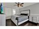 Spacious bedroom featuring a king-sized bed, stylish furniture, and a ceiling fan at 2375 Belen Dr, Deltona, FL 32738