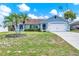 Charming single-story home featuring a well-manicured lawn and lush landscaping at 2375 Belen Dr, Deltona, FL 32738