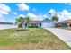 Charming single-story home featuring a well-manicured lawn and lush landscaping at 2375 Belen Dr, Deltona, FL 32738