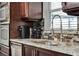 This kitchen features granite countertops, stainless steel appliances, and a modern faucet at 2375 Belen Dr, Deltona, FL 32738