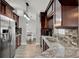 This kitchen features granite countertops, stainless steel appliances, and mosaic tile backsplash at 2375 Belen Dr, Deltona, FL 32738