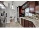 This spacious kitchen boasts granite countertops and stainless steel appliances at 2375 Belen Dr, Deltona, FL 32738