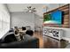Comfortable living room with a large window, a ceiling fan, and a stylish TV display at 2375 Belen Dr, Deltona, FL 32738