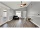 A bright living room featuring wood-look floors, and neutral walls at 2375 Belen Dr, Deltona, FL 32738