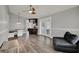 Open-concept layout with wood-look floors connecting living and dining areas at 2375 Belen Dr, Deltona, FL 32738