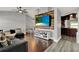 Inviting living room with tv, stylish decor, and a view of the dining room and kitchen at 2375 Belen Dr, Deltona, FL 32738