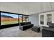 Cozy screened patio featuring contemporary outdoor furniture and access to the backyard at 2375 Belen Dr, Deltona, FL 32738