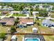 Aerial view of a home with a fenced yard, a shed, and a screened-in pool at 2375 Belen Dr, Deltona, FL 32738