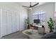 Bright home office with large window, stylish desk setup, and ample closet space at 2444 Omaha Dr, Deltona, FL 32738