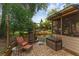 Charming backyard with brick patio, outdoor kitchen, and screened-in porch offering a private retreat at 25438 Pine Valley Dr, Sorrento, FL 32776