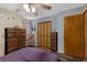 Comfortable bedroom features natural light, ceiling fan, and spacious closet at 25438 Pine Valley Dr, Sorrento, FL 32776
