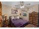 Relaxing bedroom with modern decor, ceiling fan, and ample storage at 25438 Pine Valley Dr, Sorrento, FL 32776