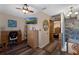 Hallway with wood flooring and an office desk with rolling chair at 25438 Pine Valley Dr, Sorrento, FL 32776
