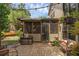 Relaxing screened patio with string lights, and brick pavers, perfect for outdoor lounging at 25438 Pine Valley Dr, Sorrento, FL 32776