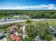 Expansive aerial view showcasing the property, landscaping, and surrounding neighborhood and natural features at 2641 Delcrest Dr, Orlando, FL 32817