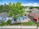 Backyard view with a brick patio, white furniture, and surrounded by a tall brick wall at 2641 Delcrest Dr, Orlando, FL 32817