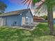 Backyard featuring green grass, a picnic table on a brick patio, and a view of the fence at 2641 Delcrest Dr, Orlando, FL 32817