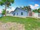 Backyard with a brick patio, shed, and trees at 2641 Delcrest Dr, Orlando, FL 32817
