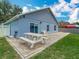 Backyard with a brick patio, picnic table, and blue siding at 2641 Delcrest Dr, Orlando, FL 32817