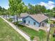 Backyard view with a brick patio, white furniture, and a shed surrounded by a tall brick wall at 2641 Delcrest Dr, Orlando, FL 32817
