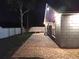Exterior view of the home's backyard with brick patio, exterior hose, picnic table, and privacy fence at 2641 Delcrest Dr, Orlando, FL 32817