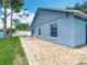 Backyard with a brick patio and blue siding at 2641 Delcrest Dr, Orlando, FL 32817