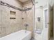Clean bathroom featuring bathtub with tiled walls, shower and neutral paint at 2641 Delcrest Dr, Orlando, FL 32817