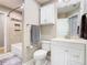 Bathroom with a white vanity, a built in cabinet, decorative mirror and a bathtub at 2641 Delcrest Dr, Orlando, FL 32817